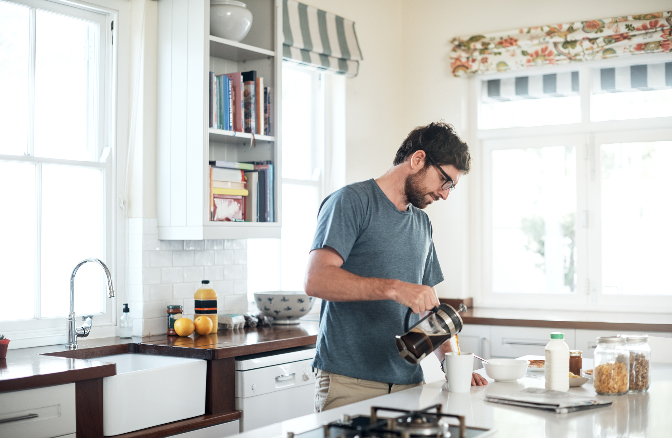 Make made at home. Man making a Coffee in the Kitchen. You Drink Coffee with your Breakfast every Day?.